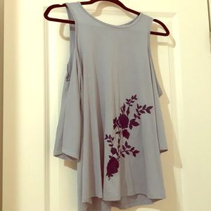 Francesca’s blue long sleeve shirt